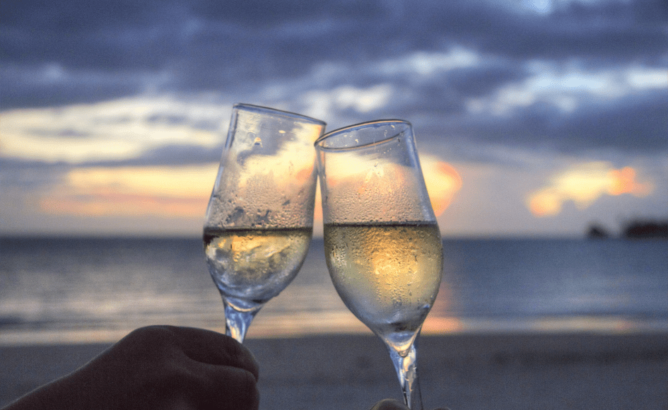 Champagne glasses clinking at sunset, perfect for date ideas in Yanchep